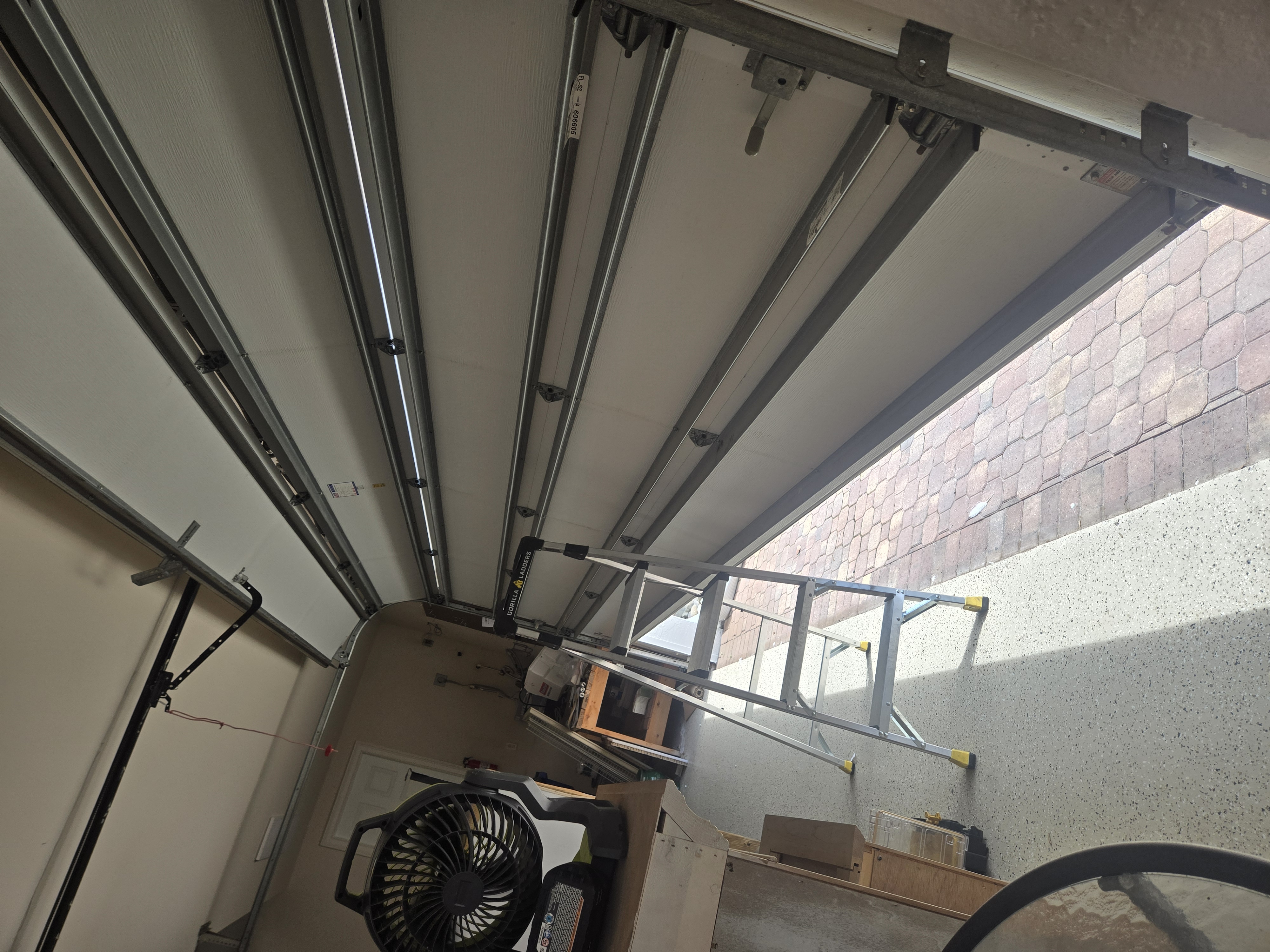 Garage door balanced and aligned after service