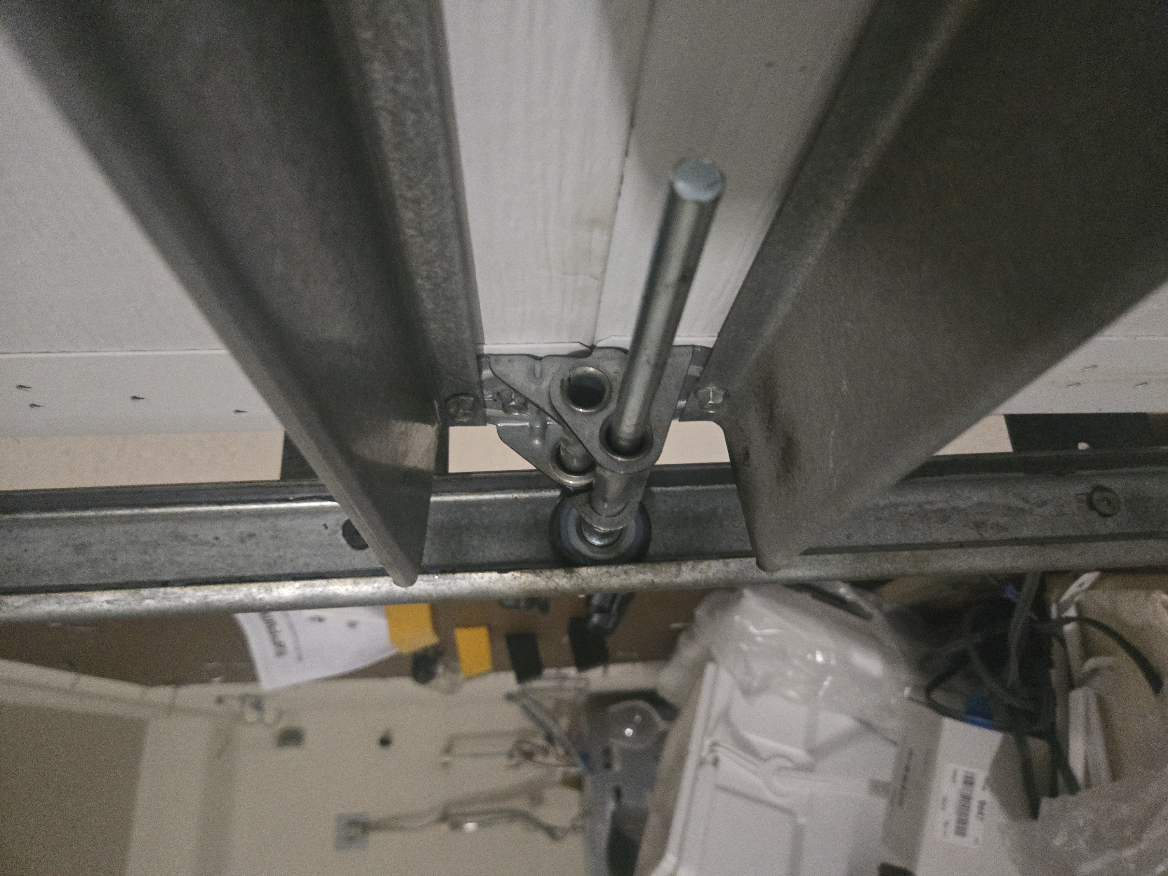 Replaced garage door roller after service, close-up detail