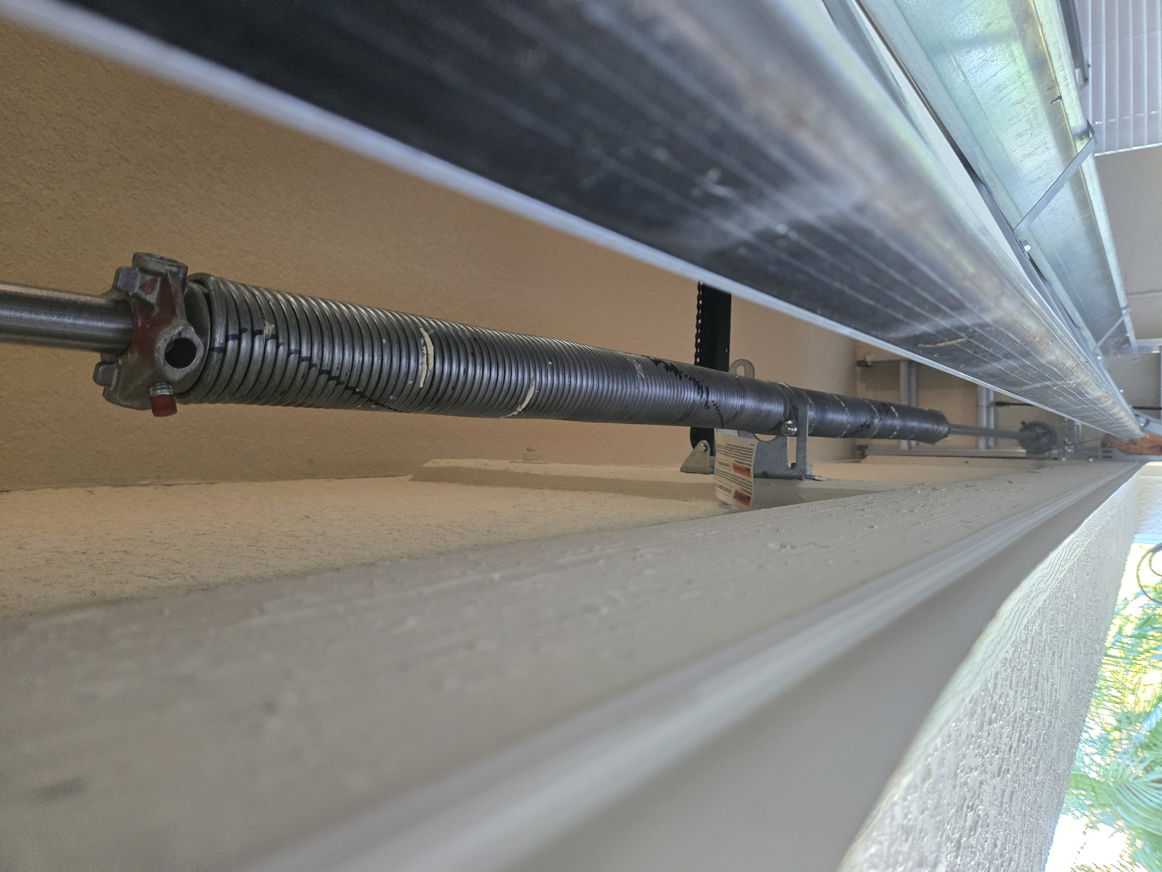 Worn garage door spring before replacement