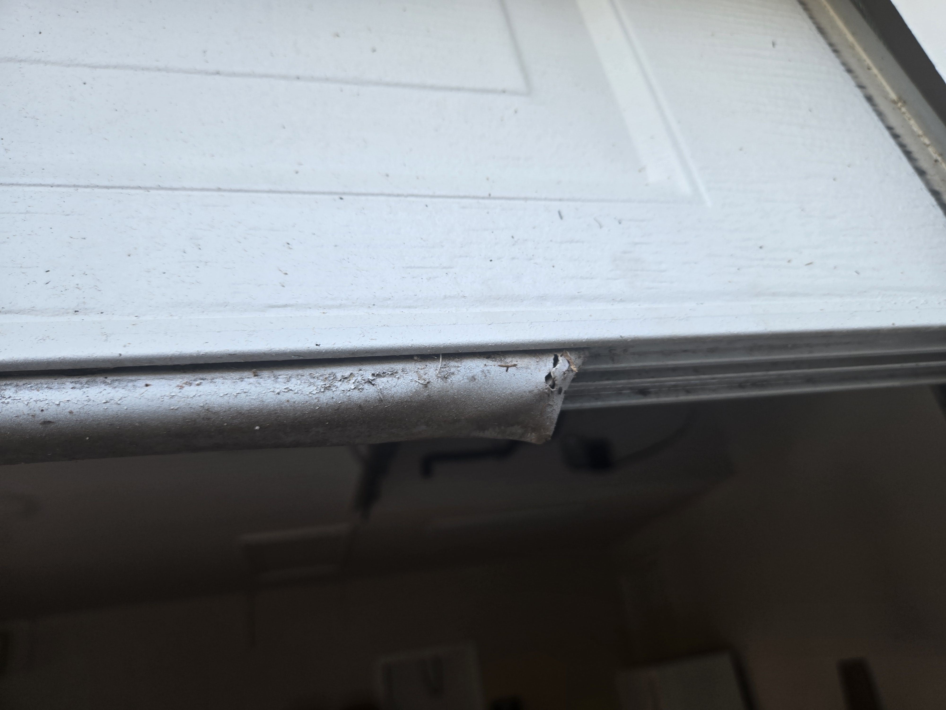 Gap under garage door before seal replacement